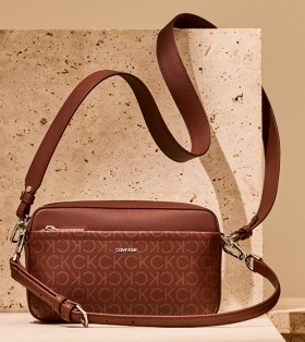 Calvin-Klein-Must-Convertible-Monogram-Camera-Bag-in-Chocolate-Monogram on sale